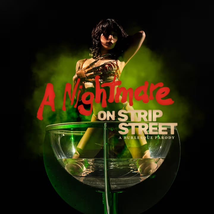 woman kneels in martini glass for Nightmare on Strip Street: A Burlesque Parody