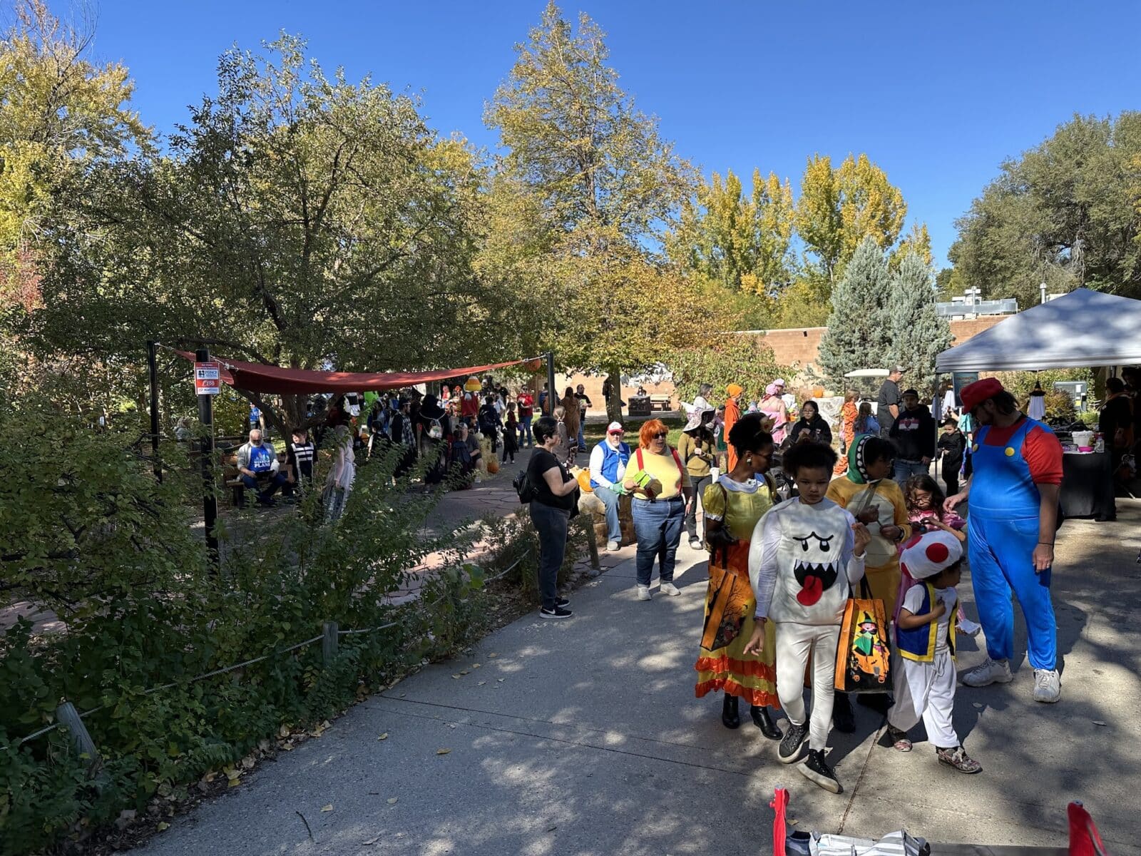 families in costumes for the Pueblo Zoo Boo