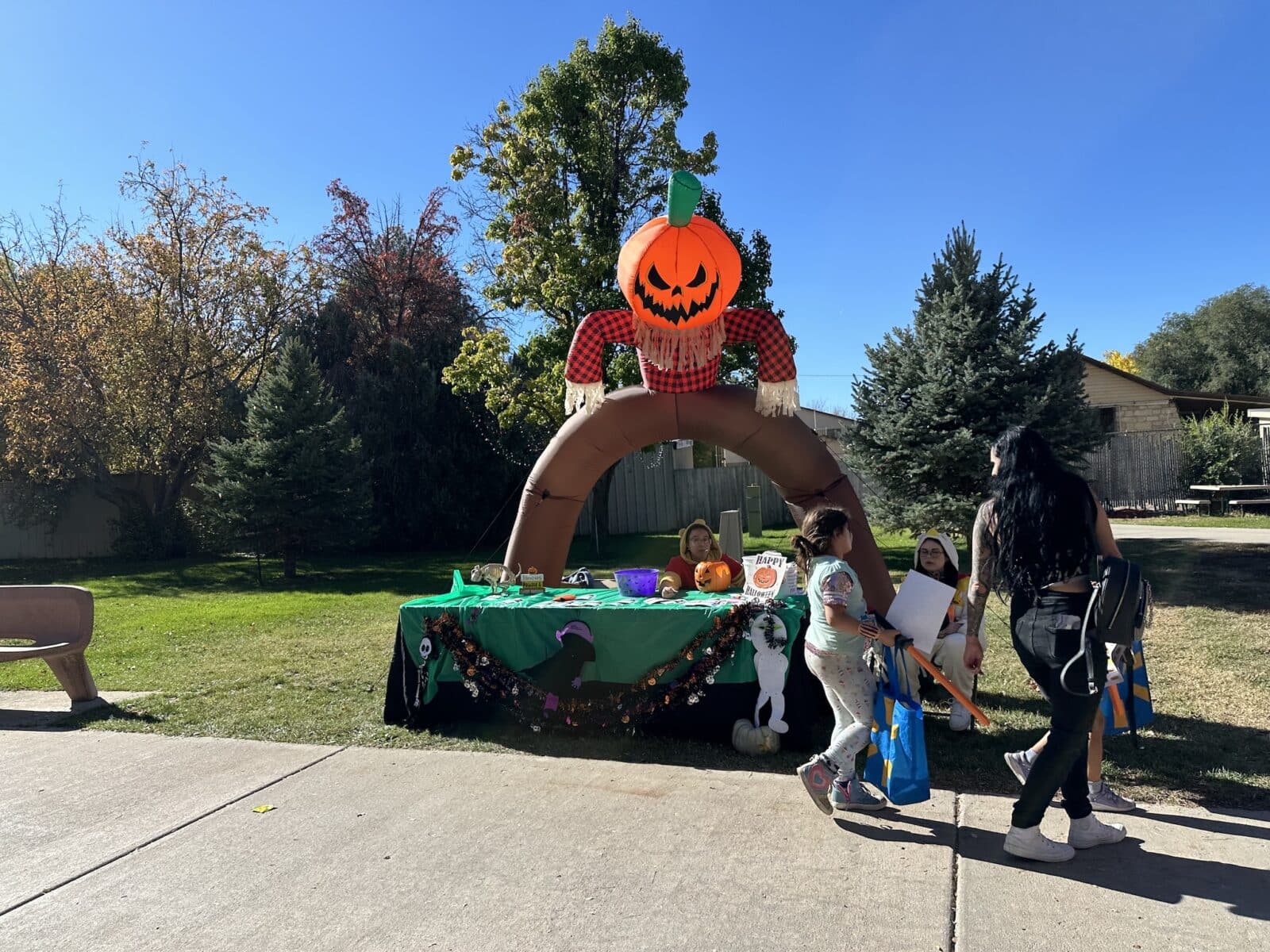 candy station with pumpkin head at Pueblo Zoo Boo