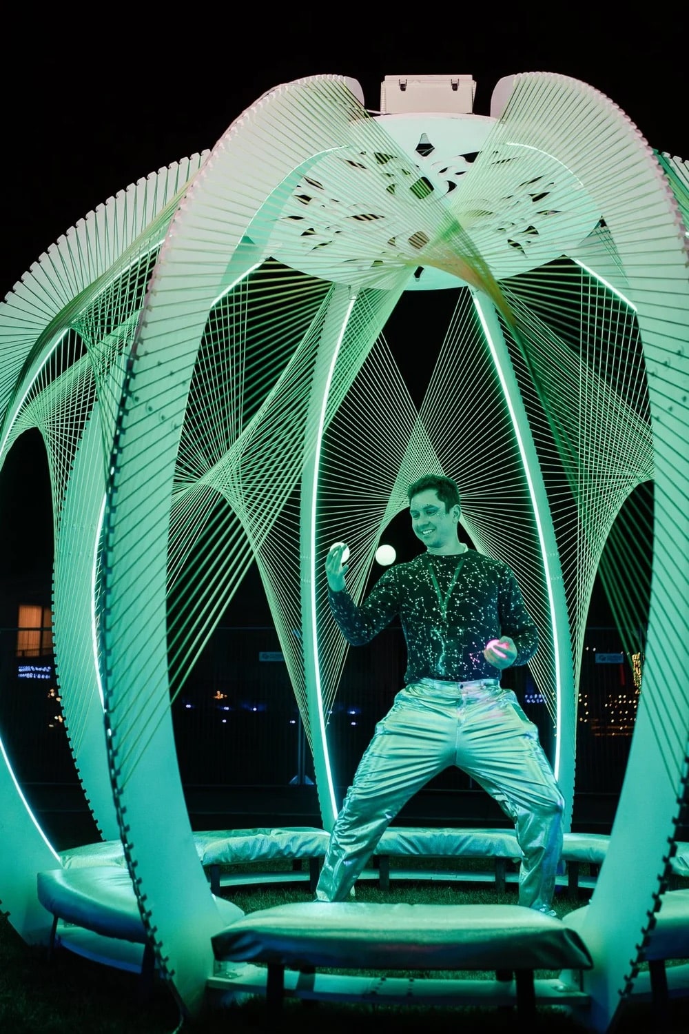 man juggles balls at the Aurora Borealis Festival in Colorado