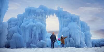 ice sculptures form large arches at Ice Castles in Colorado