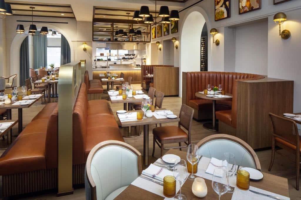 interior dining areas with booth seating and tables at The Benson Hotel in Aurora, Colorado
