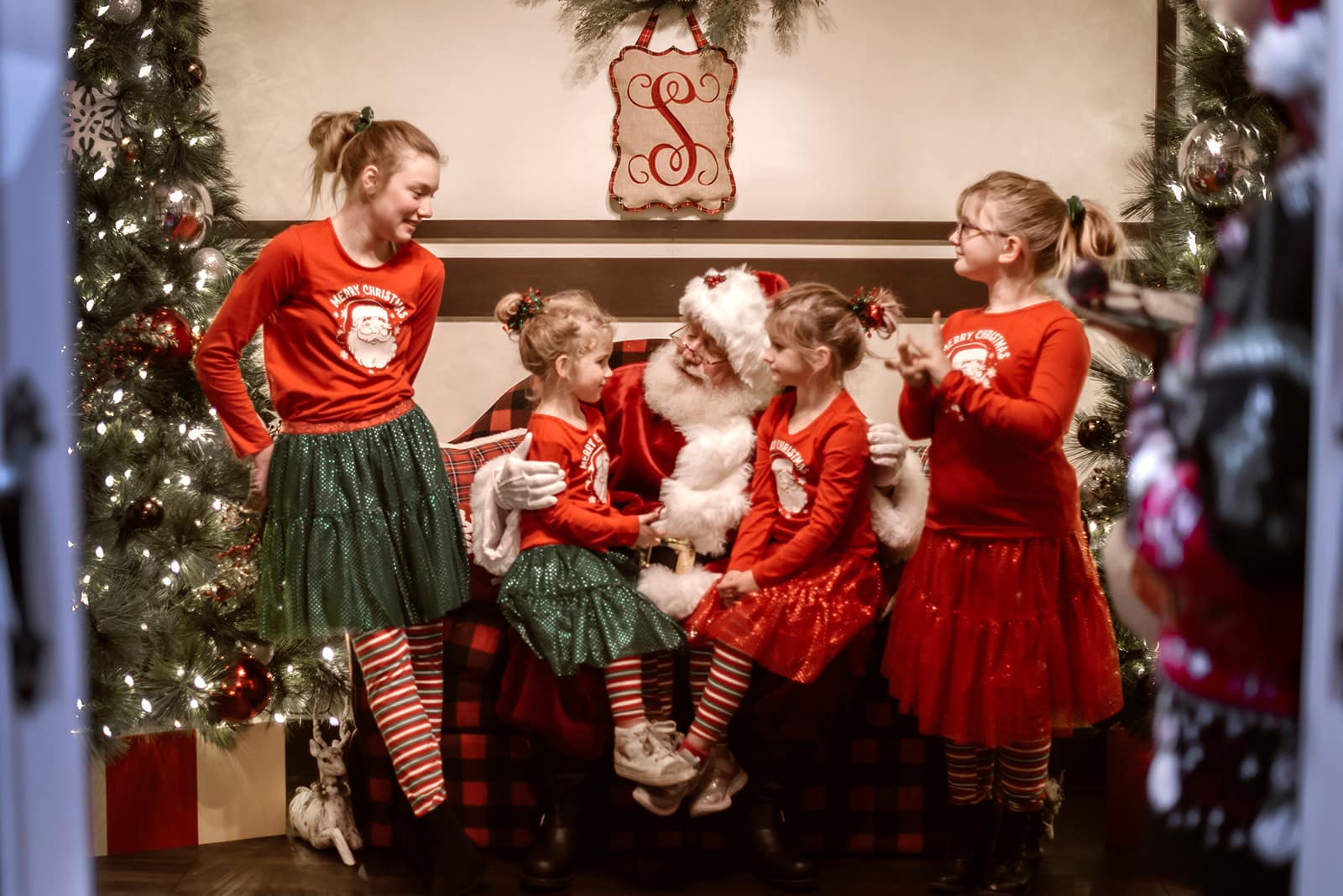 kids take a photo with Santa Claus at Orchard Town Center in Westminster