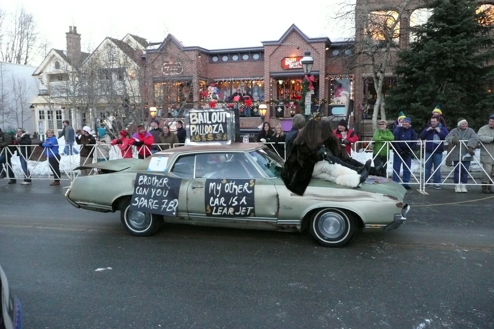 an old car with messages on it at Ullr Fest Parade