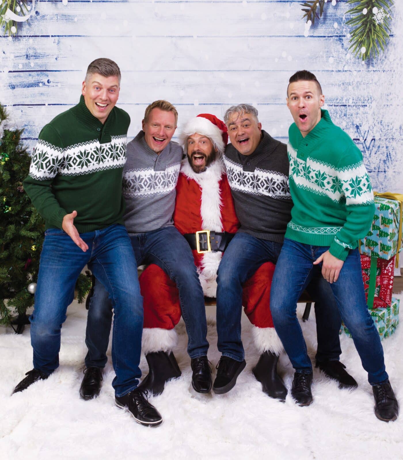 Face Vocal Band Christmas picture with band members sitting around one dressed as Santa
