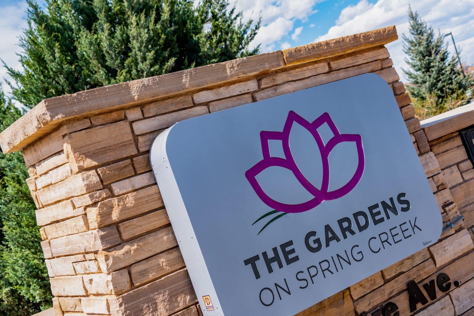 close-up of sign reading "THE GARDENS ON SPRING CREEK"