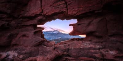 looking at Pikes Peak through a keyhole in the sandstone rocks at Garden of the Gods