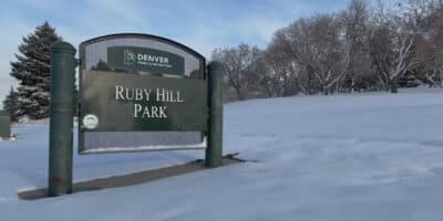 snow covered landscape around a sign for Ruby Hill park in Denver