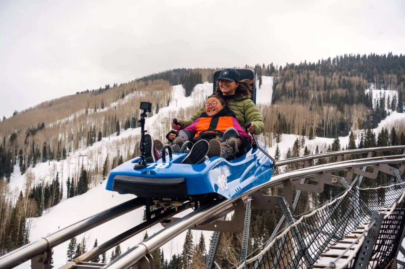 two people ride an alpine coaster at Purgatory Ski Resort in Durango, Colorado