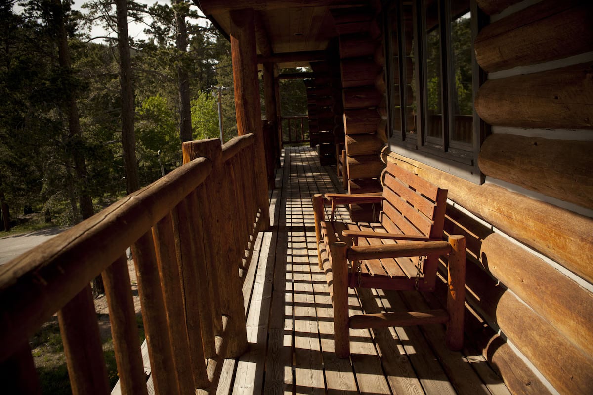 Balcony with wooden bench at Dao House in Estes Park