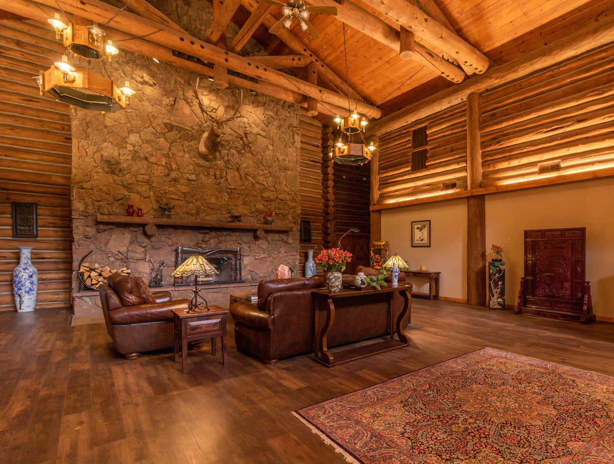 large log cabin lobby of Dao House in Estes Park