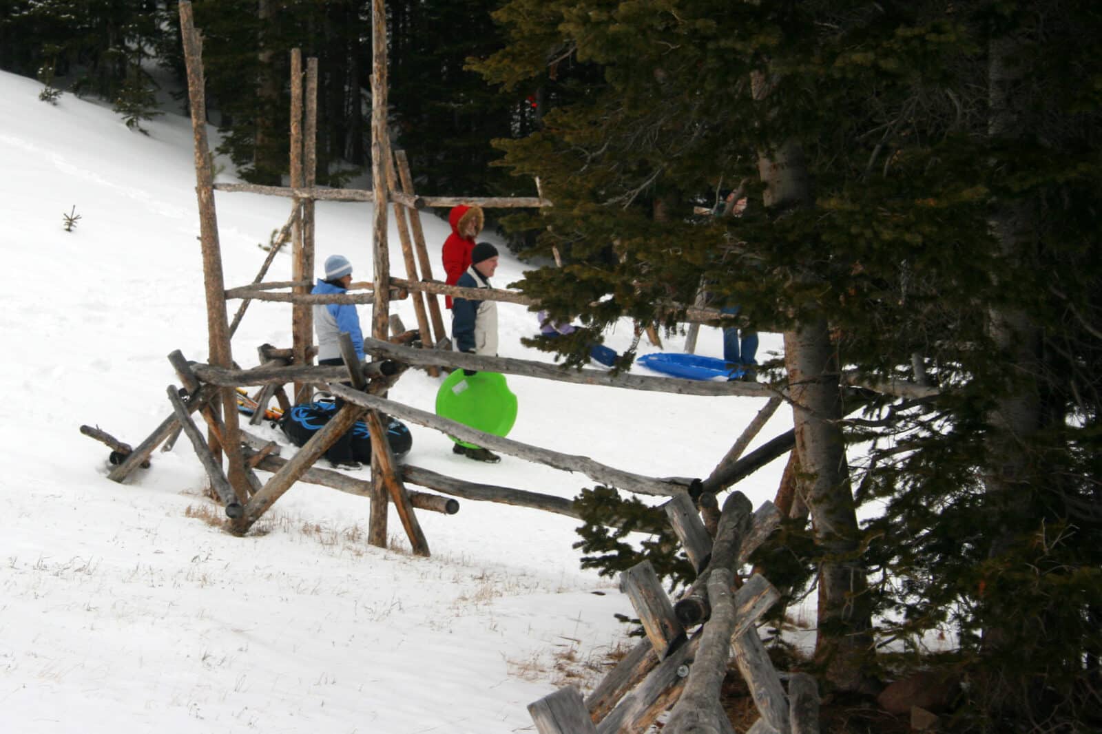 sledders holding their saucers at Hidden Valley in Rocky Mountain National Park