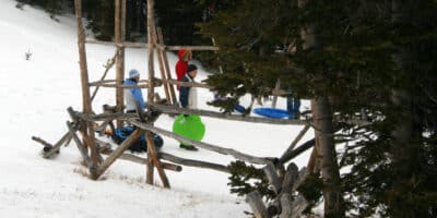 sledders holding their saucers at Hidden Valley in Rocky Mountain National Park