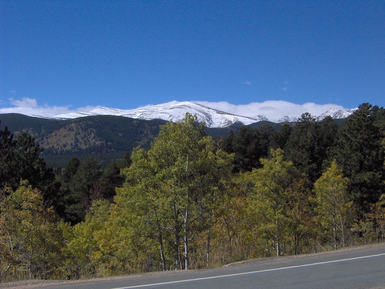 snow-capped mountain range behind the Peak to Peak Byway in Colorado